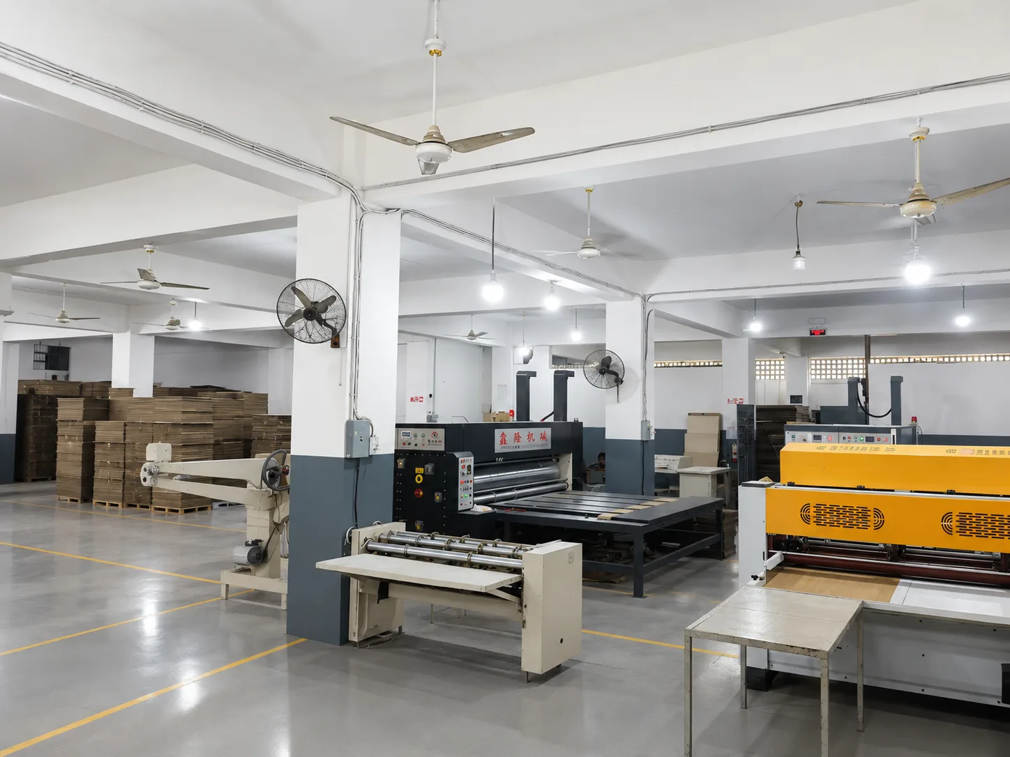Flexo printing and thin blade die-cutting machines on the production floor of our Karachi box factory